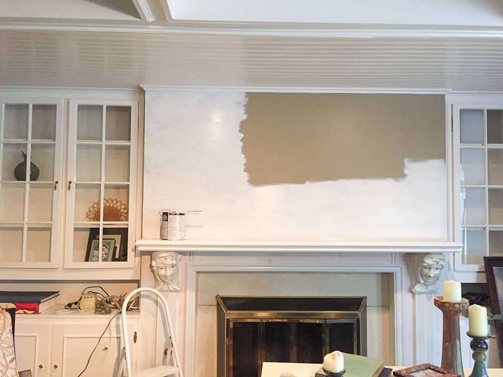 A step-by-step DIY fireplace makeover tutorial – See how it went from extra creepy to clean and classic on a very small budget! 