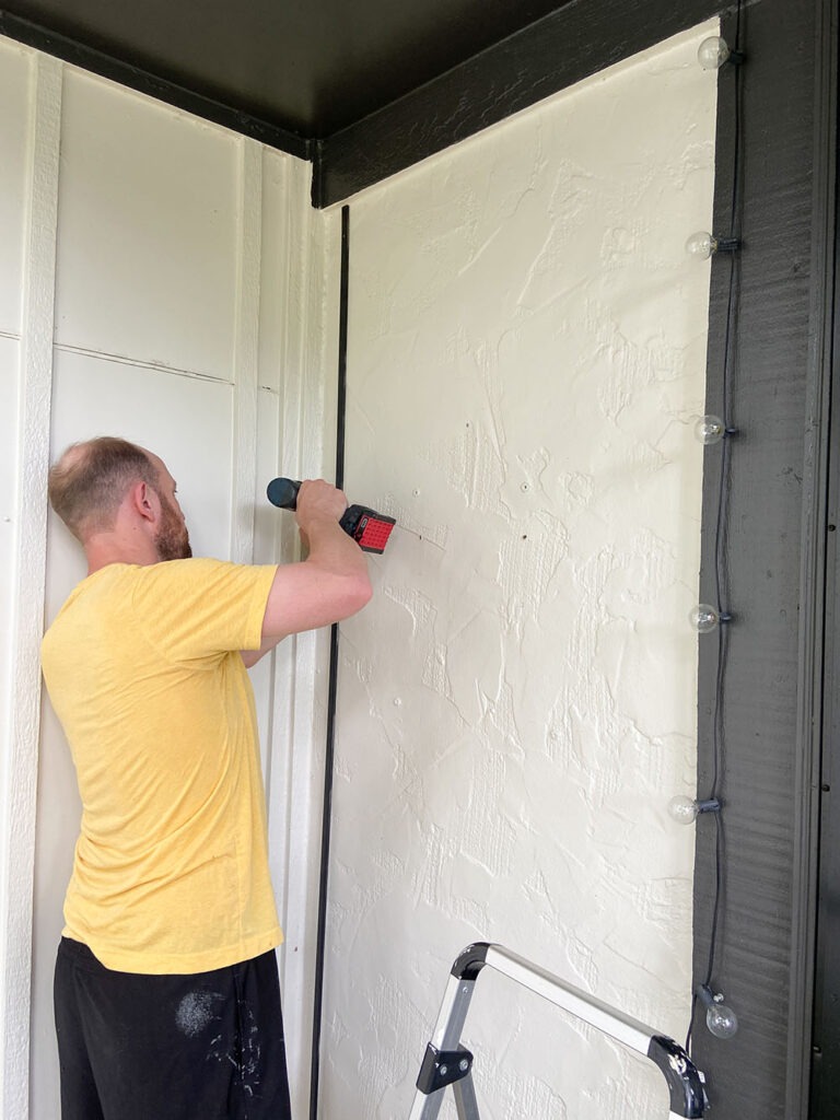 adding vertical trim to wall of porch - for cladding to rest on.