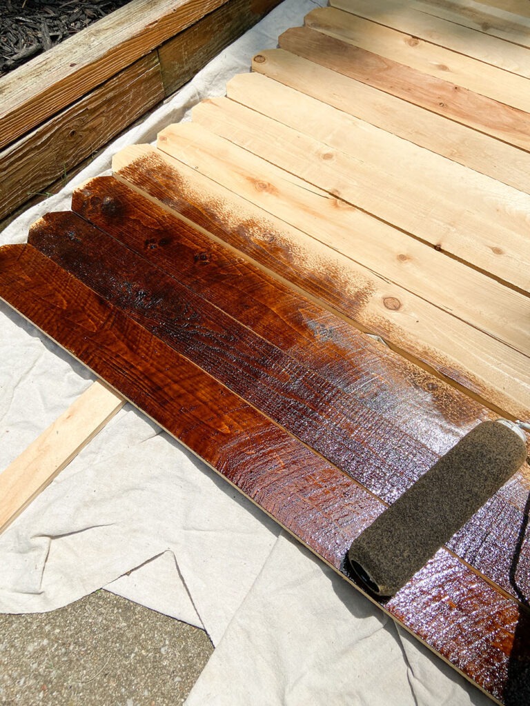 Staining wood fence picket boards with paint roller