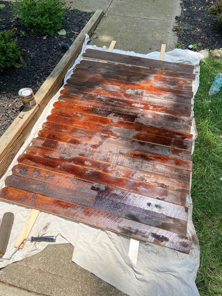 Staining wood fence picket boards