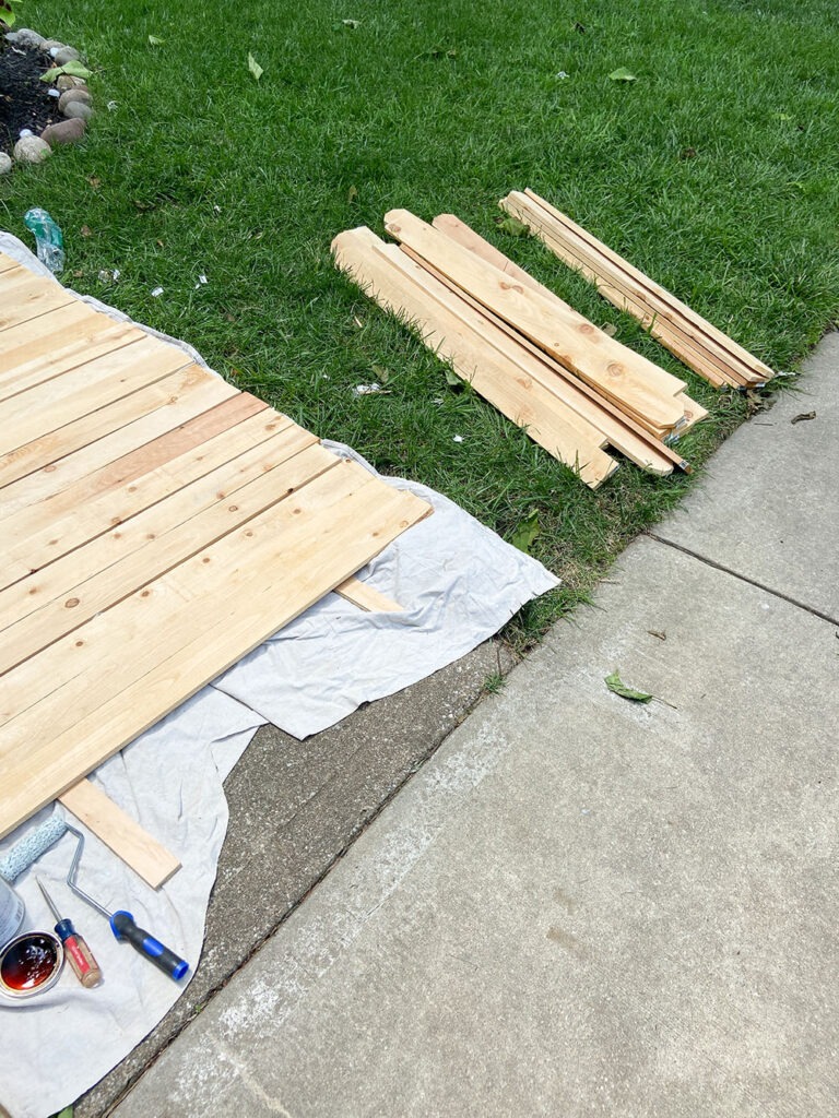 Staining wood fence picket boards