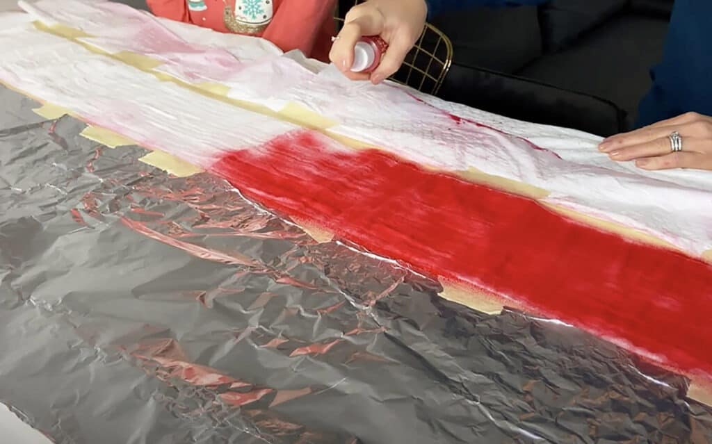 spray red tumble dye on muslin blanket