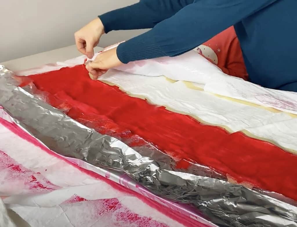 spray red tumble dye on muslin blanket