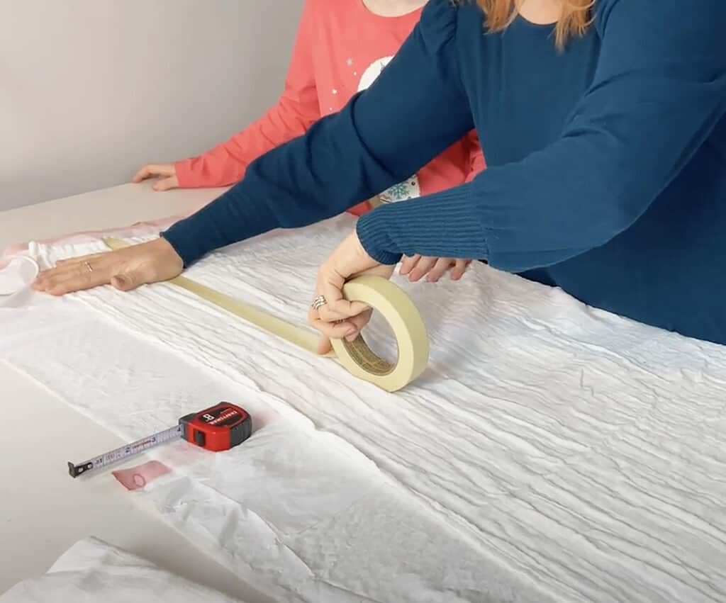 measure and tape off sections of blanket with masking tape