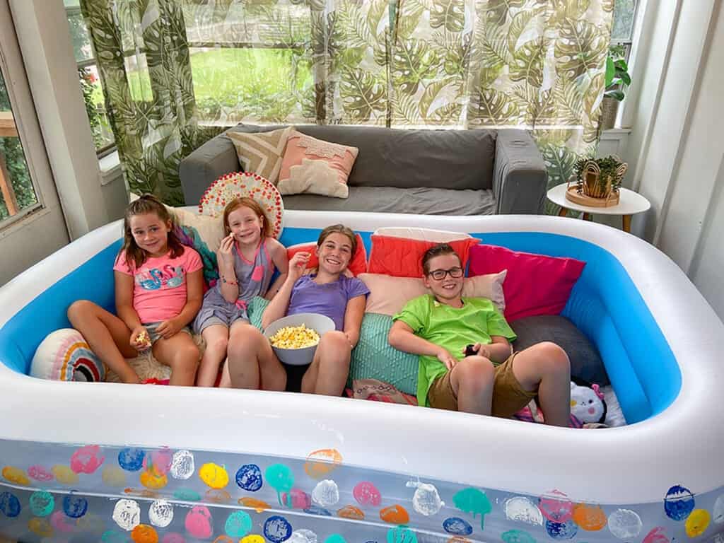 How to turn an inflatable kiddie pool into a super cute DIY lounge. Such a fun and comfortable way to upgrade kid's movie time!