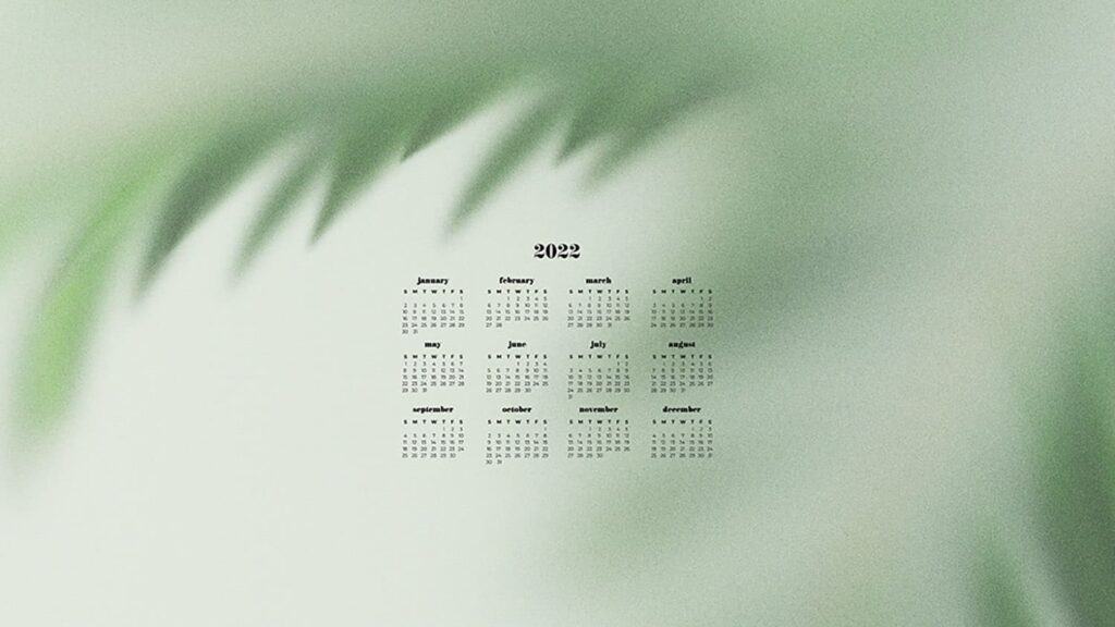 green plants blurred out with 2022 full-year calendar for your desktop 