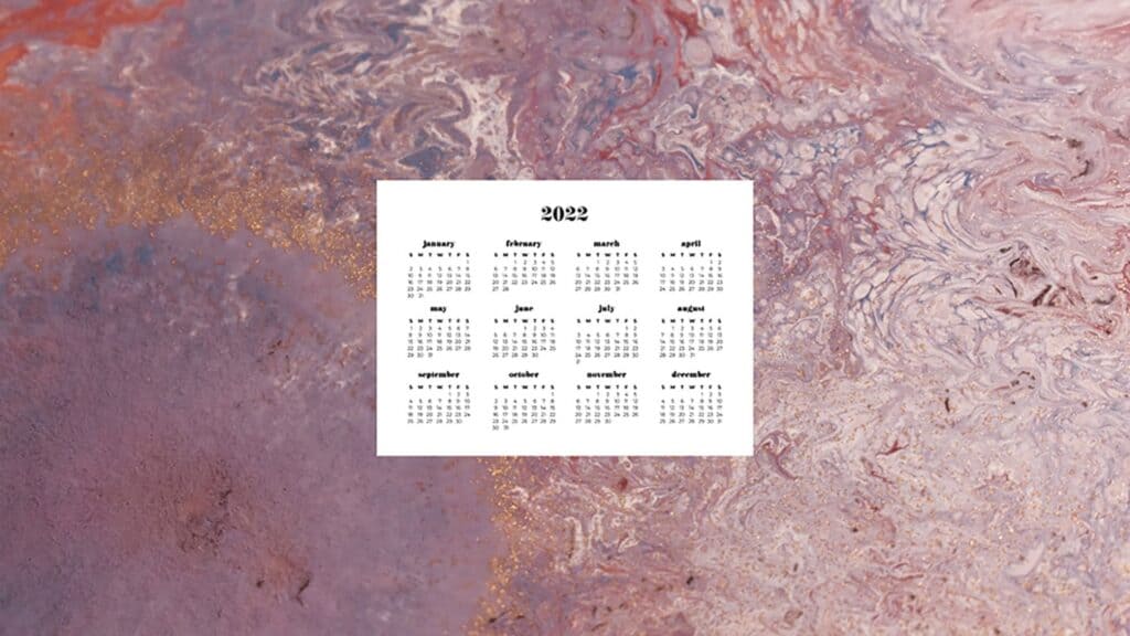 pink, purple, gold paint swirls with 2022 full-year calendar 