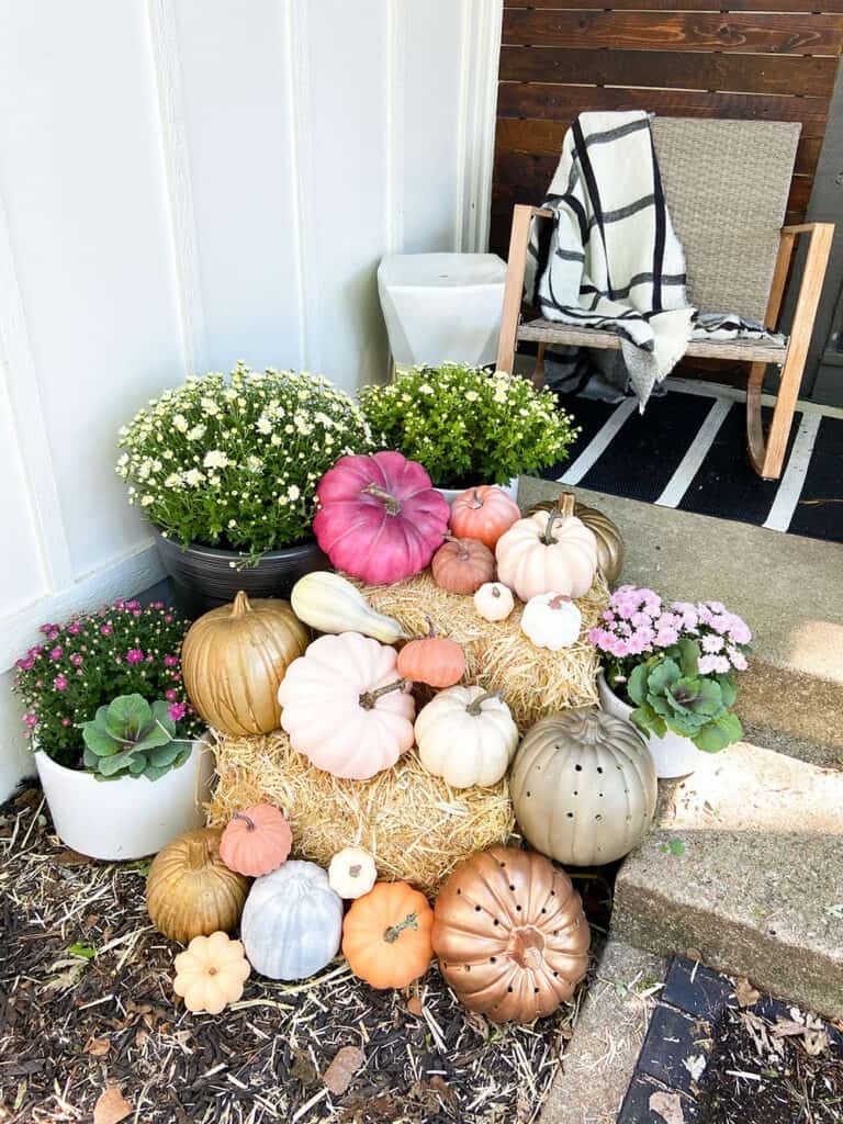 Fall front porch and window box decor tips with lots of colorful pumpkins and plants