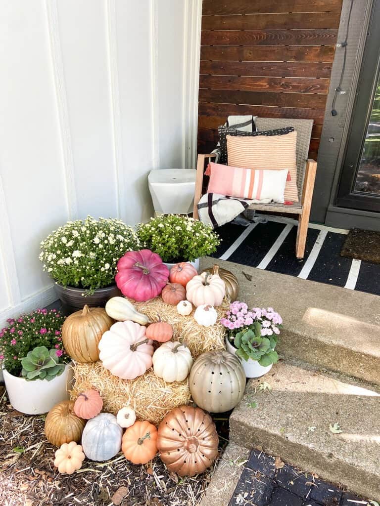 Fall front porch and window box decor tips with lots of colorful pumpkins and plants