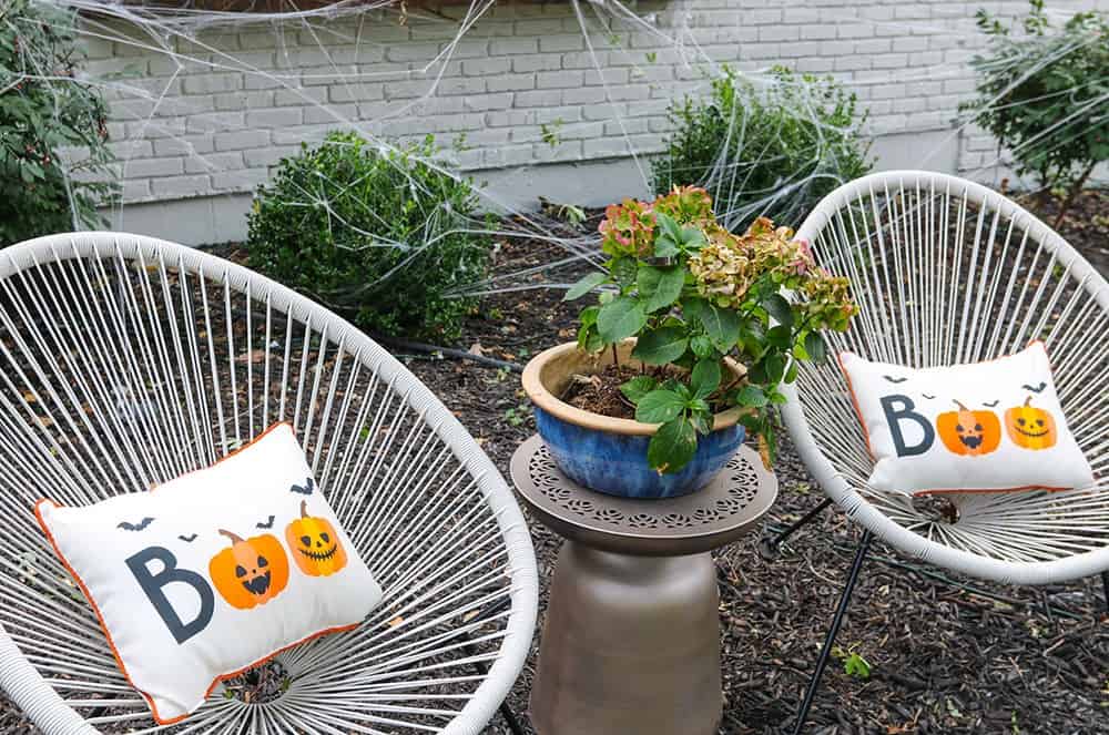 Boo halloween outdoor pillows and modern chairs