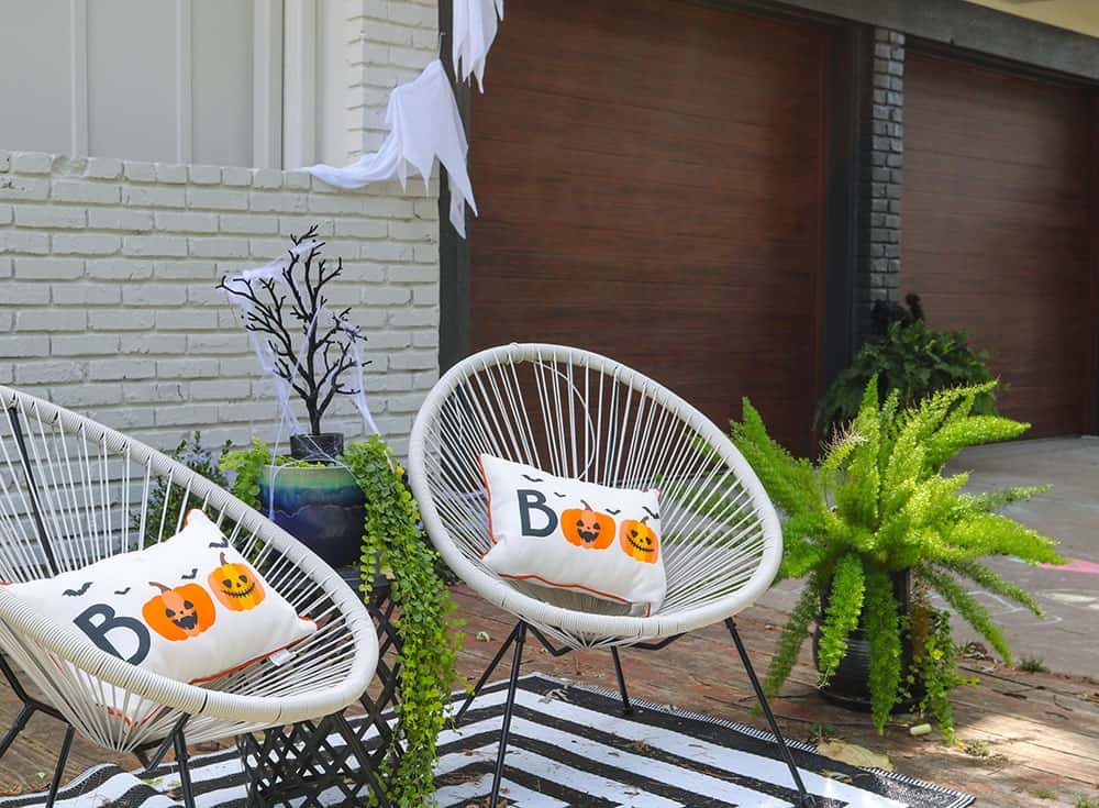 Boo halloween outdoor pillows and modern chairs