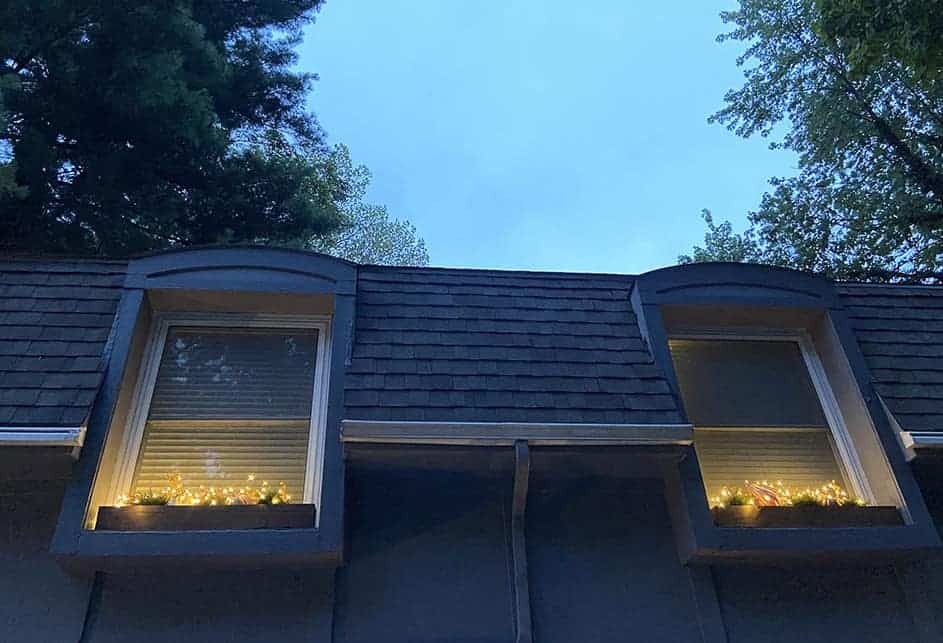 fall front porch and window boxes at night