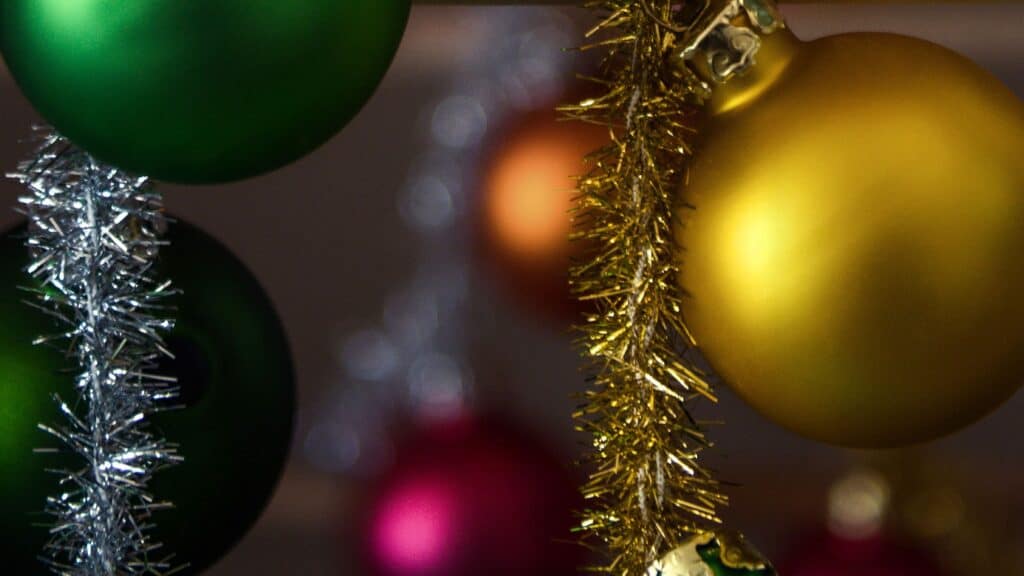 tinsel garland and colorful ornaments - free december digital wallpapers