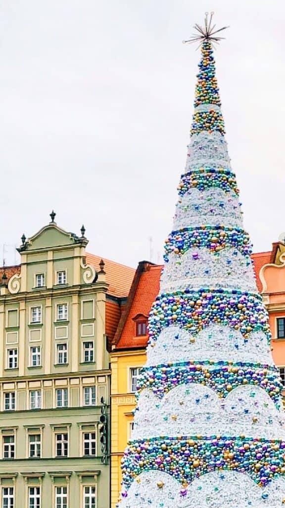 colorful ornate buildings with a christmas tree - free december digital wallpapers