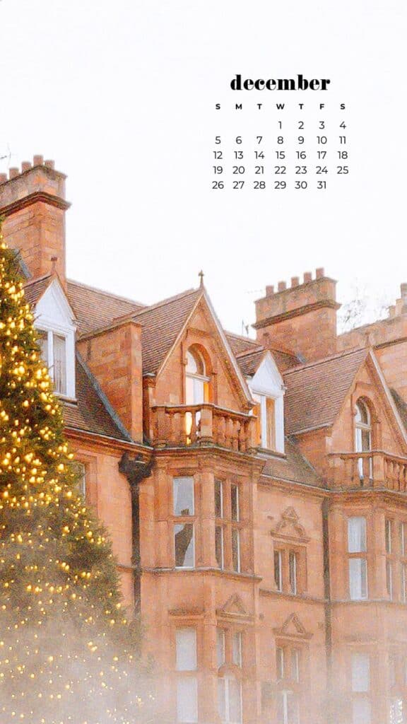 coral pink mansion castle with a beautiful large pine tree with lights - free december digital wallpapers