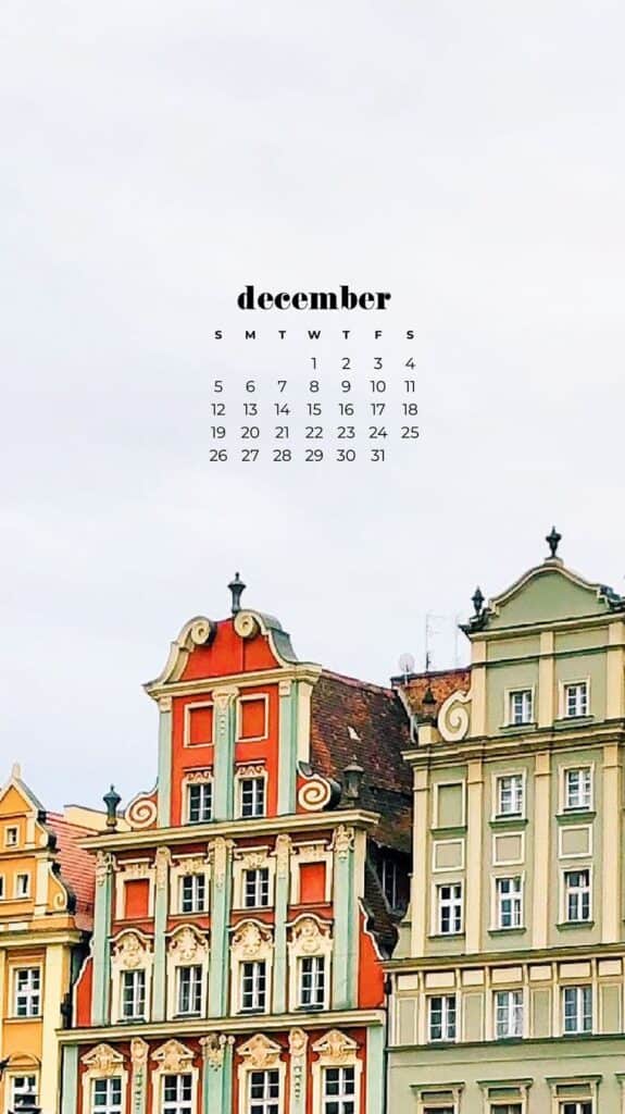 colorful ornate buildings with a christmas tree - free december digital wallpapers