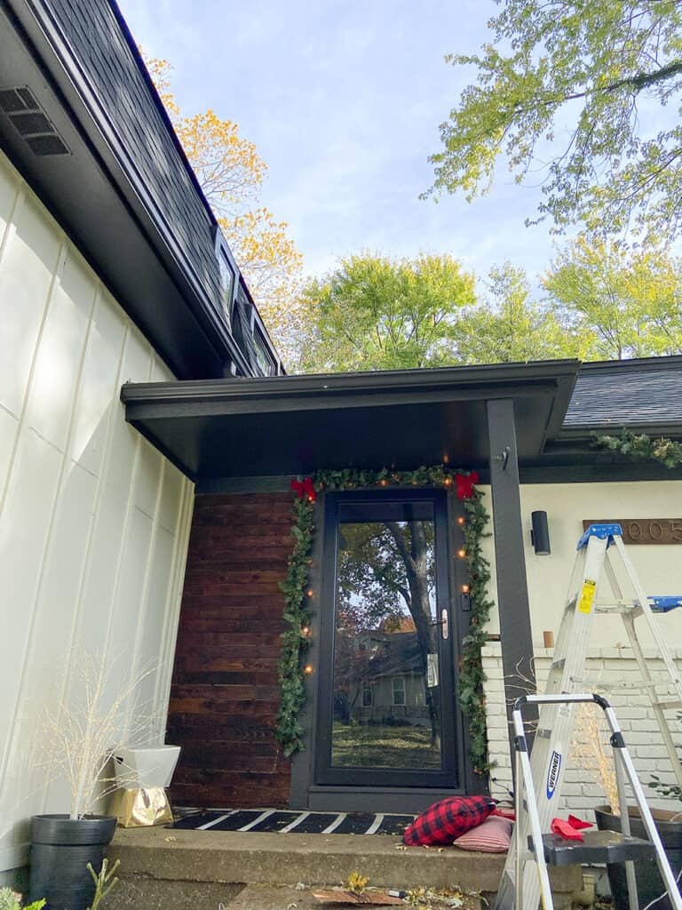 front porch holiday decor in process shot