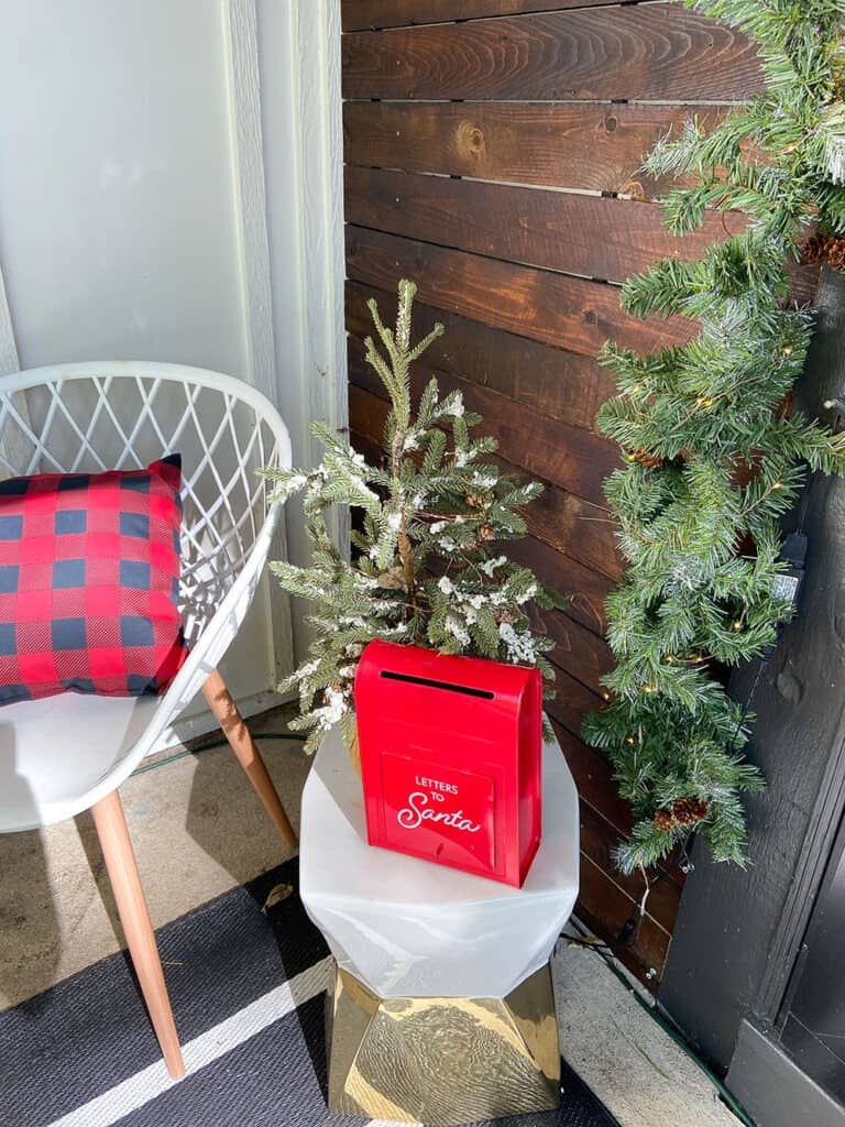 front porch holiday decor ideas red, black, and white with greenery