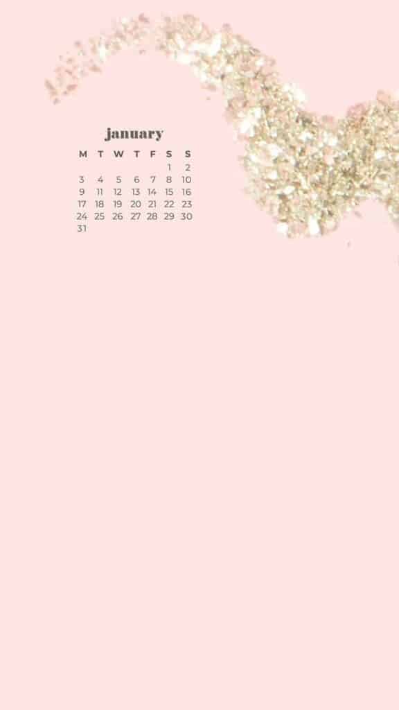 January 2022 pink background with hand holding champagne glass of gold glitter