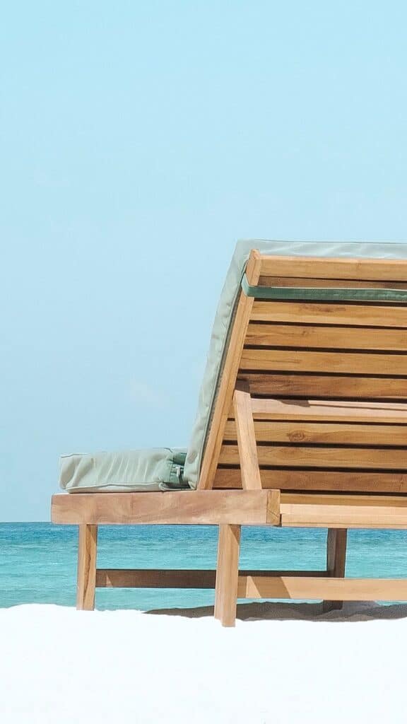 two beach chairs at the ocean