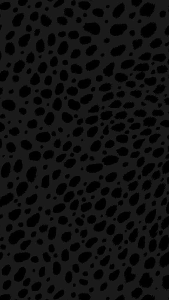 black animal print spots on dark gray background