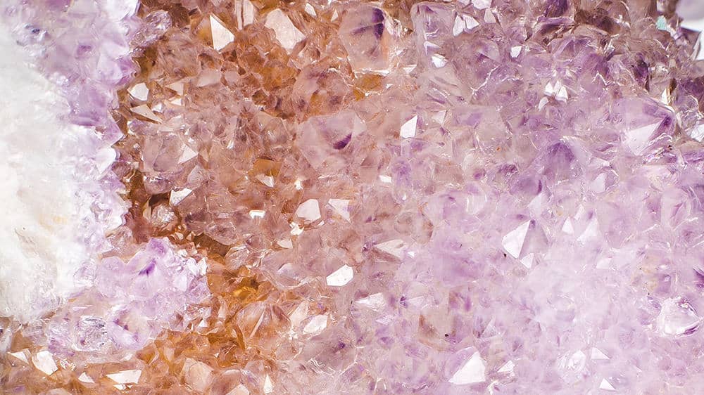 purple lilac and peach cream colored crystals close up