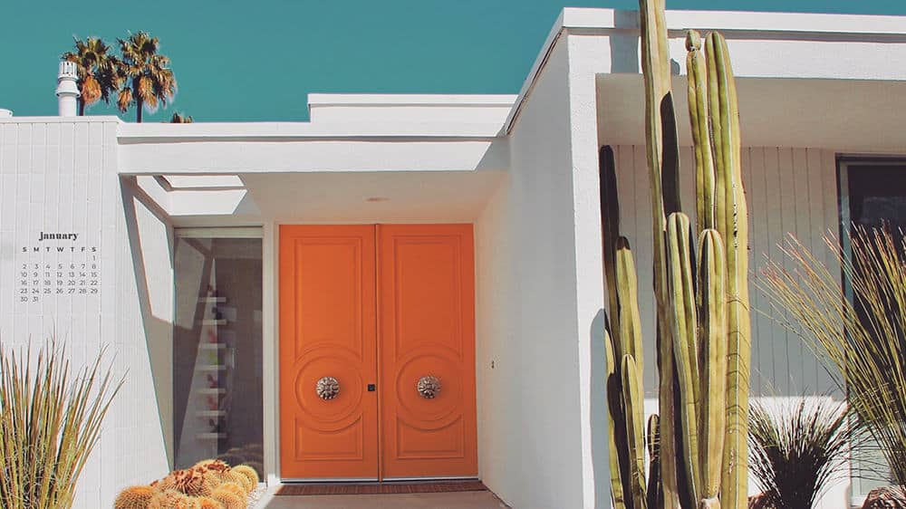 mid-century modern home in palm springs with orange doors