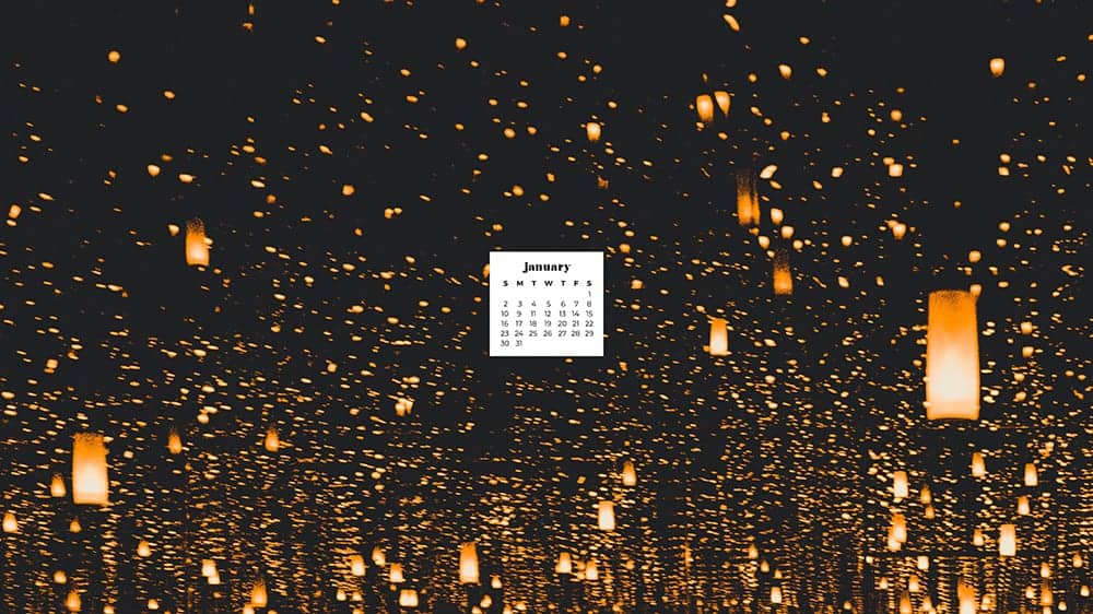 thousands of orange lanterns on dark background