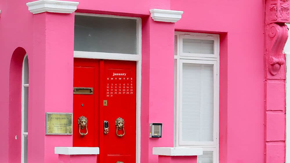 pink house with red doors in notting hill london uk - january 2022 wallpapers