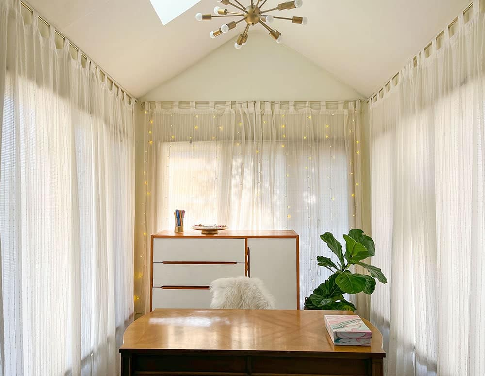Adding pretty window curtain lights to hoe office nook window