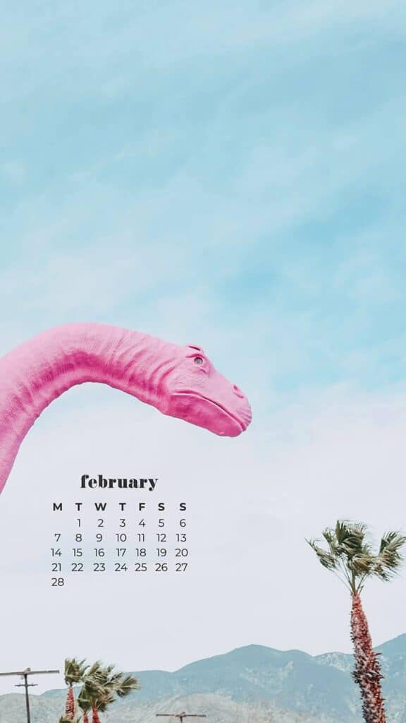 pinnk dinosaur with love heart with palm trees on blue sky - February 2022 wallpapers – 50 FREE calendars for your desktop & phone!