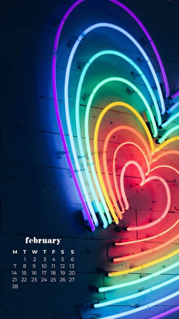 neon rainbow heart on navy wall background - February 2022 wallpapers – 50 FREE calendars for your desktop & phone!