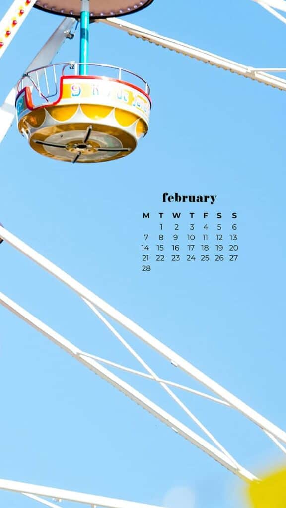 colorful ferris wheel against blue sky