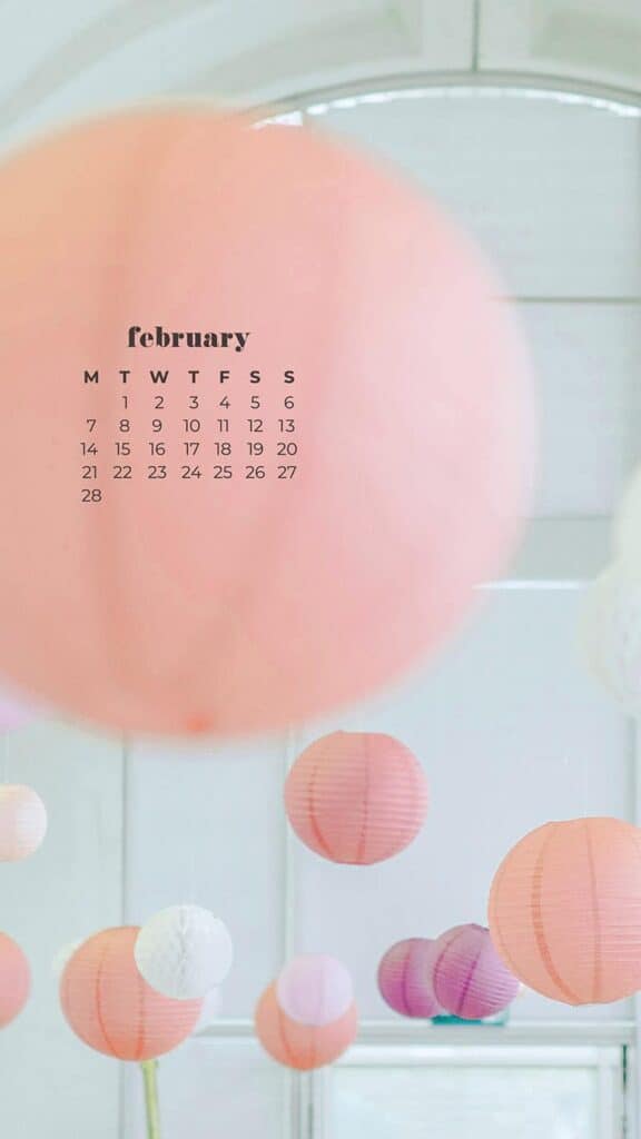 February 2022 pink, purple, peach, white, and coral round paper lanterns hanging in a white room - February 2022 wallpapers – 50 FREE calendars for your desktop & phone!