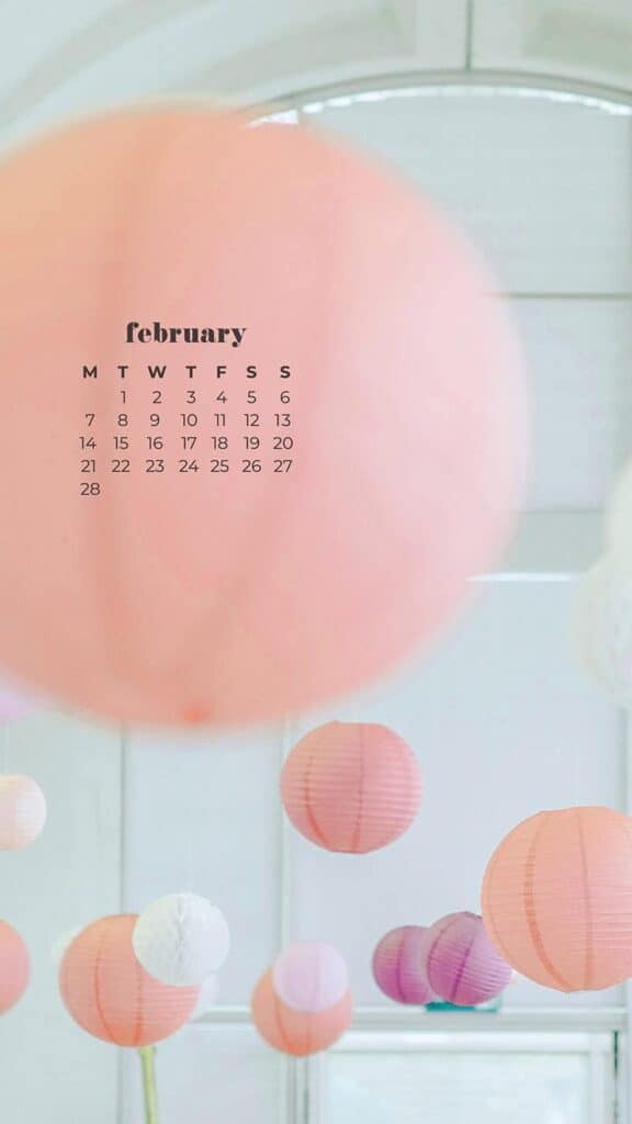 February 2022 pink, purple, peach, white, and coral round paper lanterns hanging in a white room - February 2022 wallpapers – 50 FREE calendars for your desktop & phone!