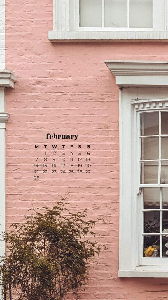 pretty pink painted brownstone flat with cool old black door