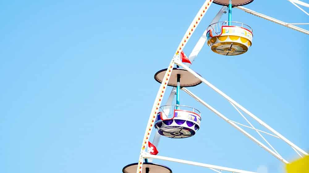 colorful ferris wheel against blue sky