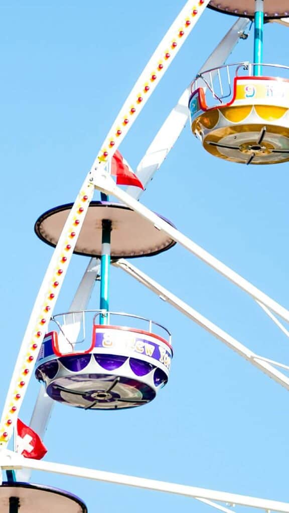 colorful ferris wheel against blue sky