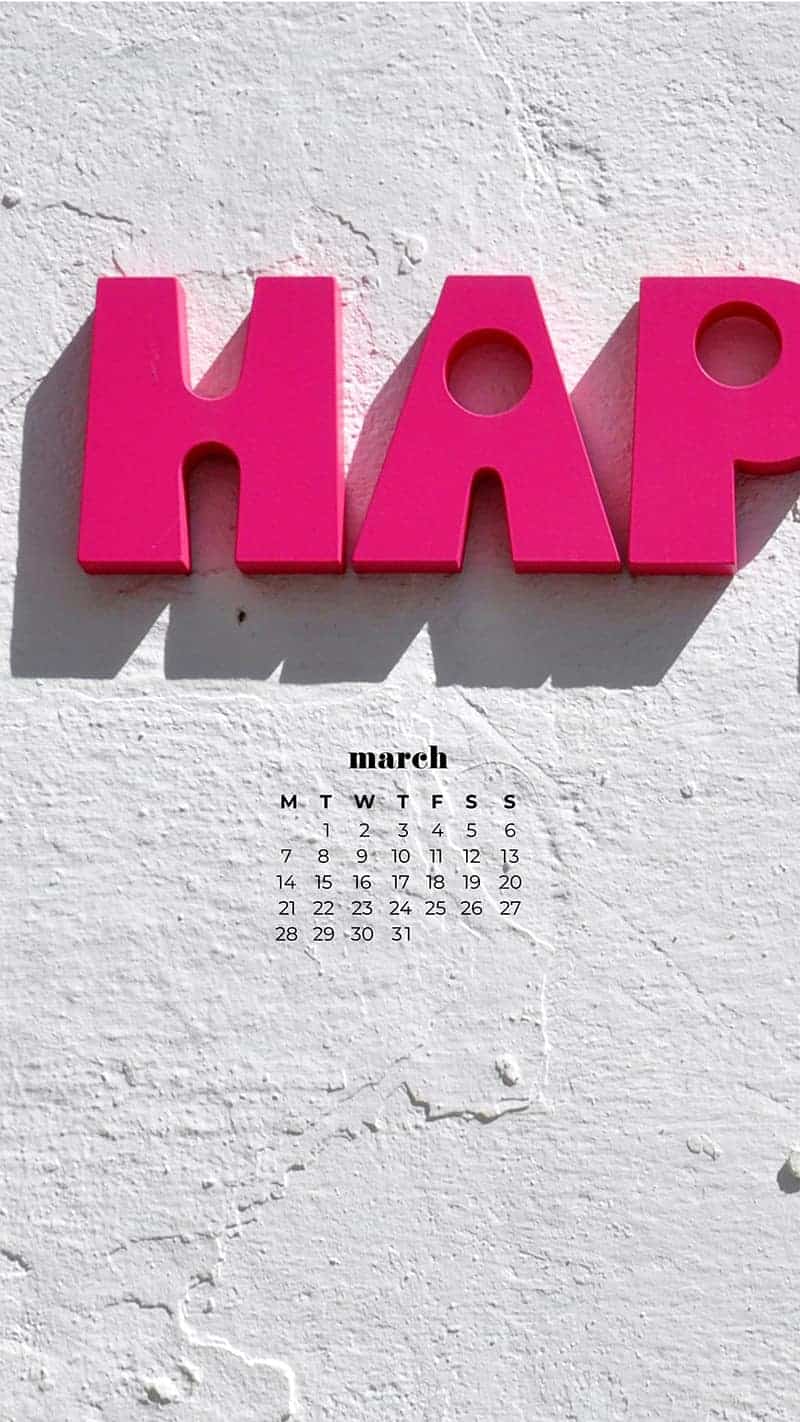 Bold pink letters that read be happy on white building - March 2022 free desktop wallpaper