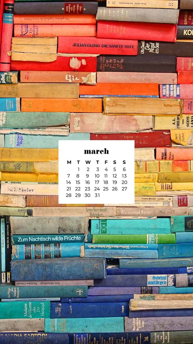 colorful vintage books stacked to fill the entire frame - March 2022 free desktop wallpaper