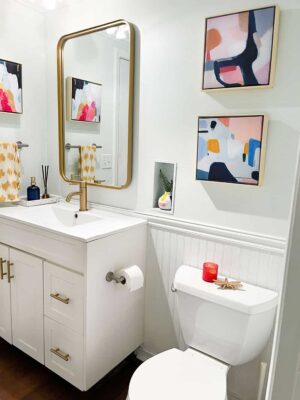 coordinating colorful and modern half bath connected to laundry room