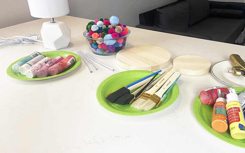 Rainbow wood slice and pom pom lamp – Colorful, fun, and easy DIY decor ideas for a kid's room or birthday party activity!