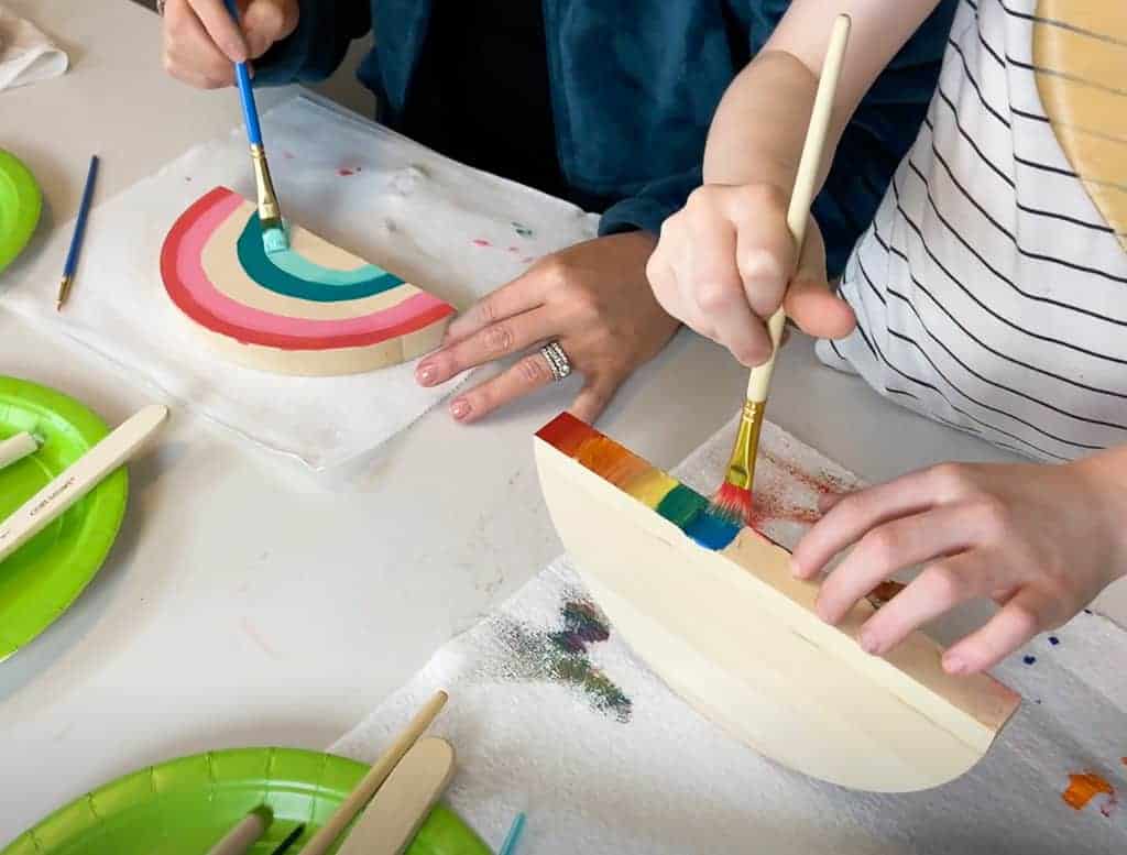 Rainbow wood slice and pom pom lamp – Colorful, fun, and easy DIY decor ideas for a kid's room or birthday party activity!