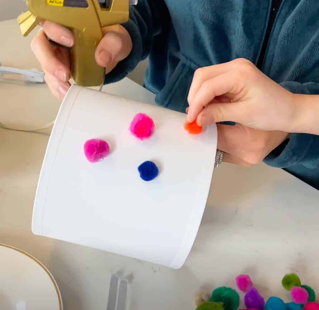 Rainbow wood slice and pom pom lamp – Colorful, fun, and easy DIY decor ideas for a kid's room or birthday party activity!