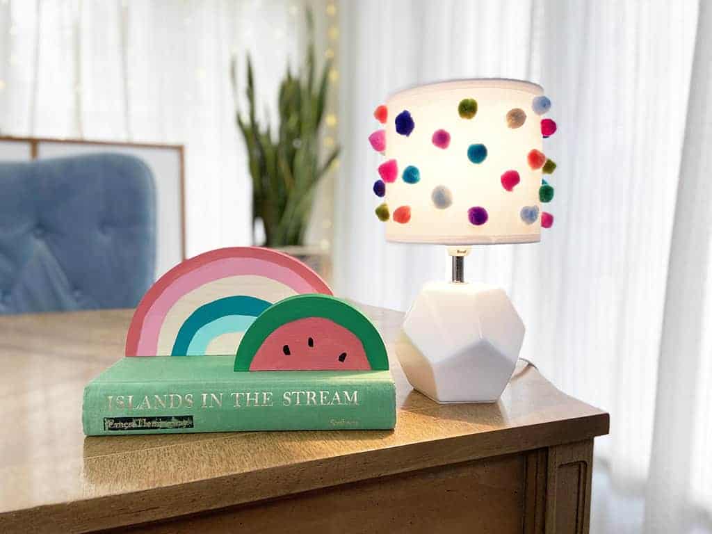 Rainbow wood slice and pom pom lamp – Colorful, fun, and easy DIY decor ideas for a kid's room or birthday party activity!