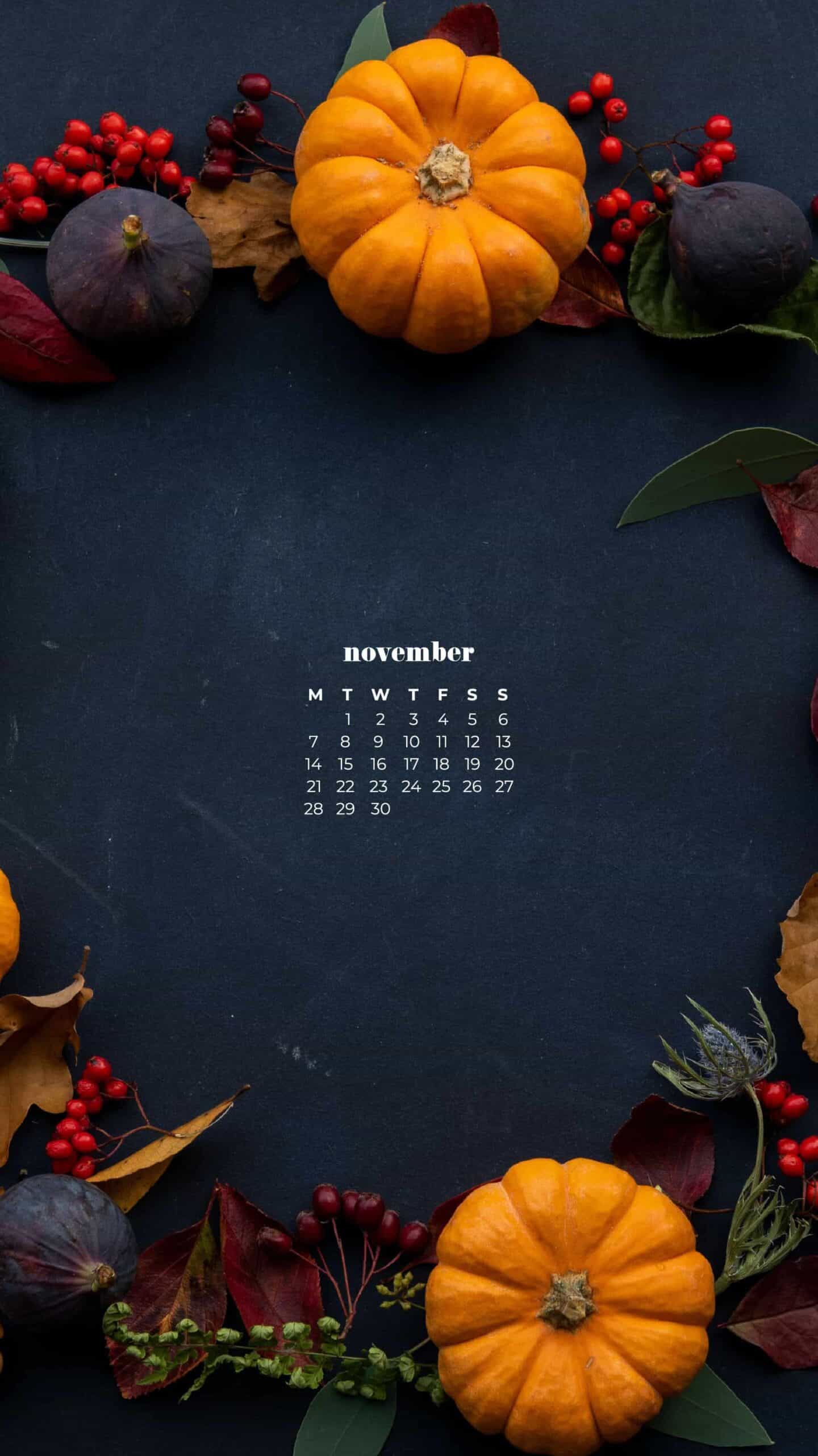 navy background with colorful pumpkins, berries, and fall foliage in a circle wreath flat lay - thanksgiving inspired shot November 2022 wallpapers – FREE calendars in Sunday & Monday starts + no-calendar designs. 59 beautiful options for desktop & smart phones!