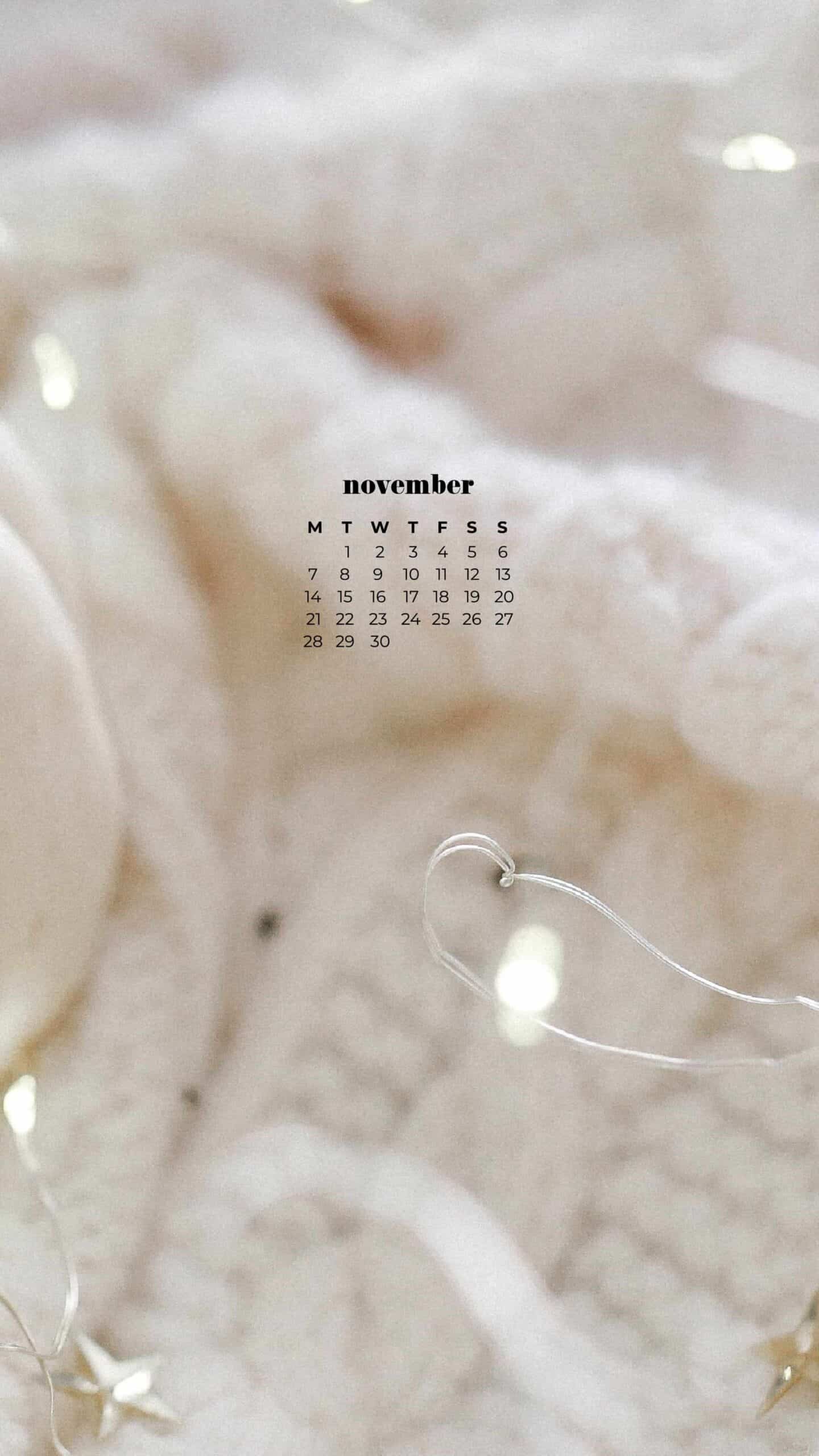 white soft blanket with a white pumpkin and fairy lights, cozy neutral scene on a fall autumn day November 2022 wallpapers – FREE calendars in Sunday & Monday starts + no-calendar designs. 59 beautiful options for desktop & smart phones!