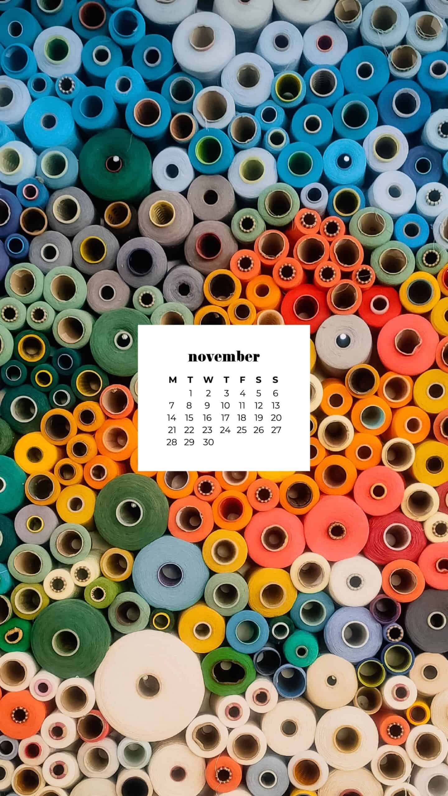 colorful rolls of fabric stacked on a shelf November 2022 wallpapers – FREE calendars in Sunday & Monday starts + no-calendar designs. 59 beautiful options for desktop & smart phones!