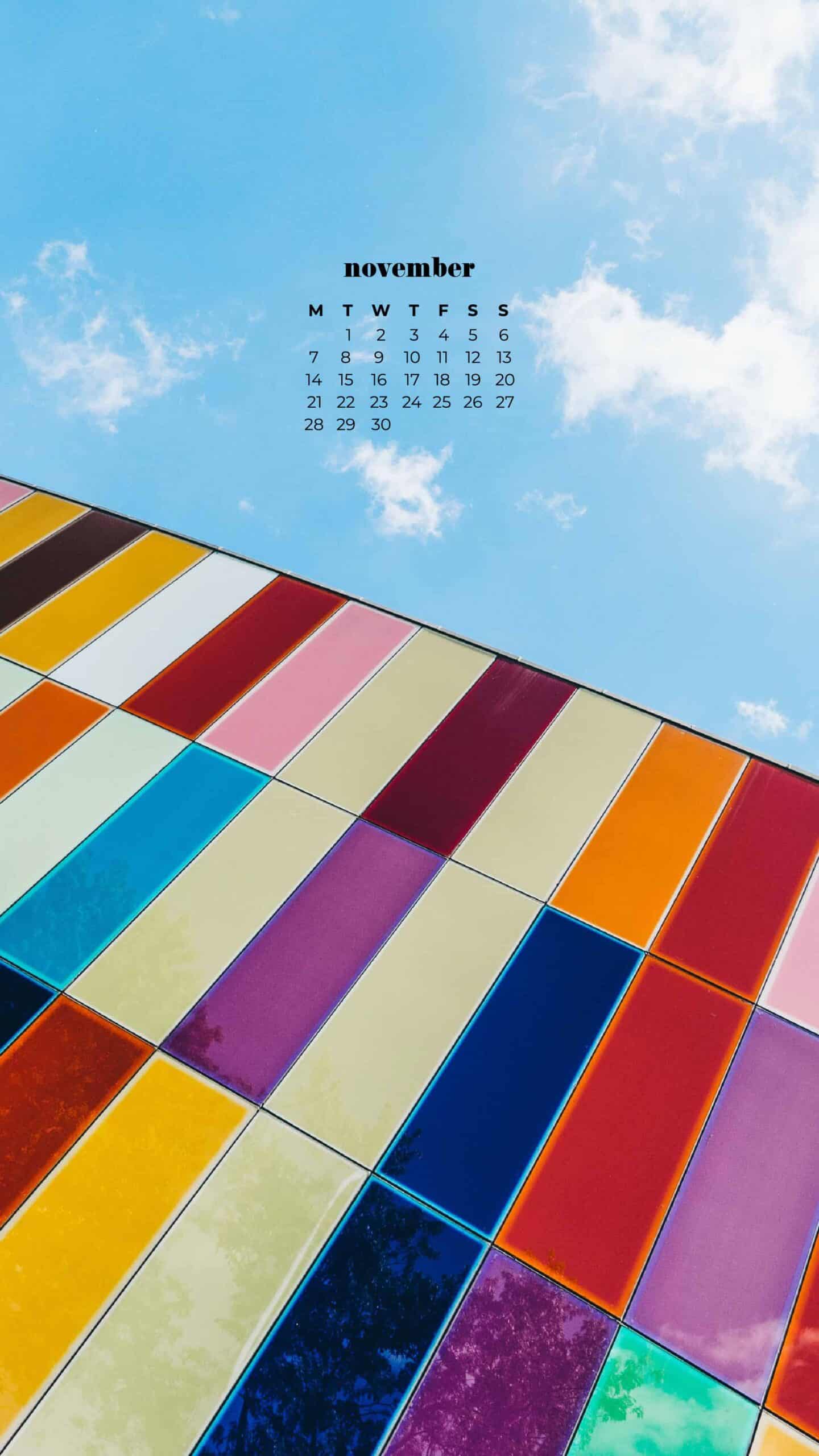 rainbow colorful modern glass building with a blue sky background November 2022 wallpapers – FREE calendars in Sunday & Monday starts + no-calendar designs. 59 beautiful options for desktop & smart phones!