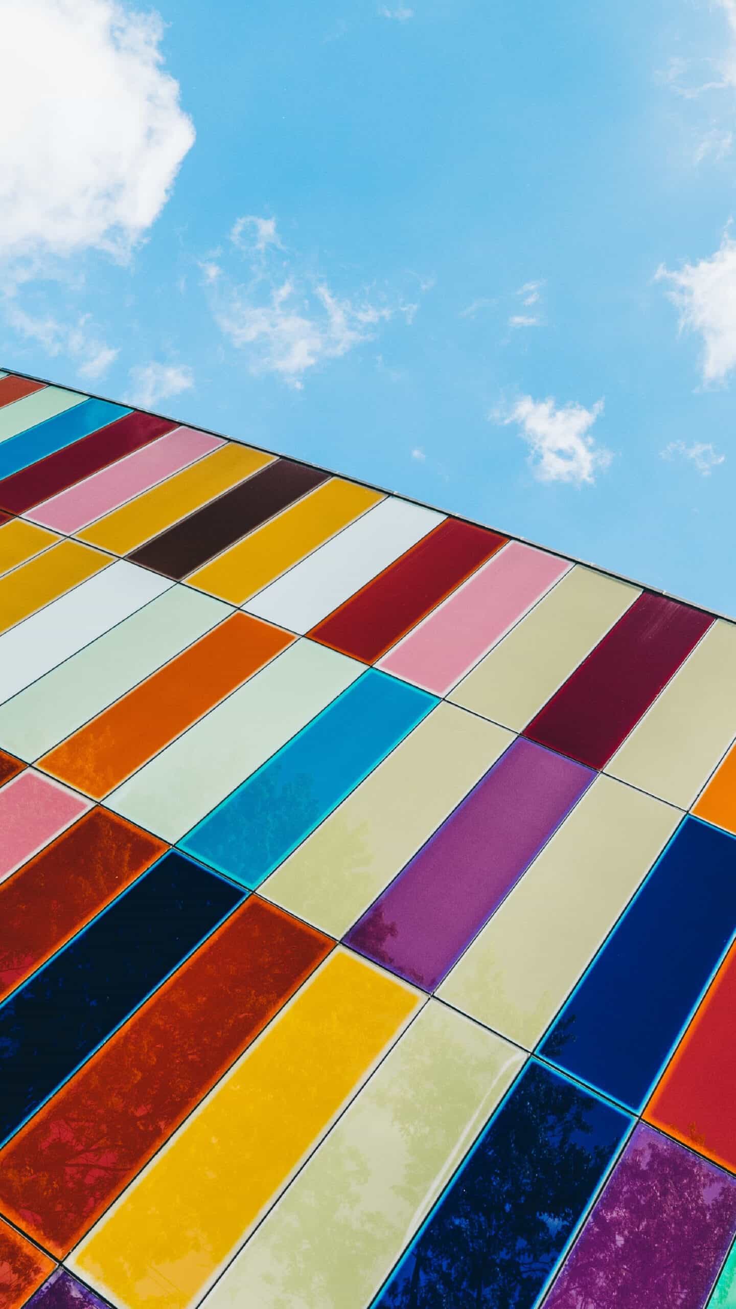 rainbow colorful modern glass building with a blue sky background November 2022 wallpapers – FREE calendars in Sunday & Monday starts + no-calendar designs. 59 beautiful options for desktop & smart phones!